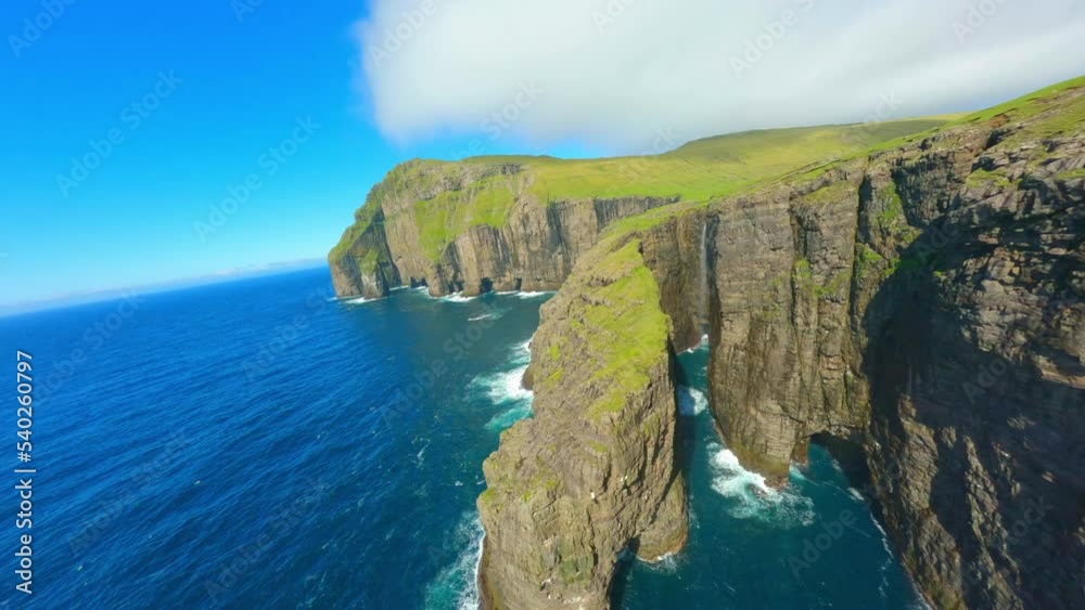 Aerial Shot Of Animals On Island Landscape In Sea, Drone Flying Forward On Sunny Day - Faroe Islands, Denmark