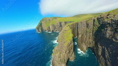 Aerial Shot Of Animals On Island Landscape In Sea, Drone Flying Forward On Sunny Day - Faroe Islands, Denmark