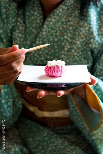 Black woman preparing to eat Wagashi, Japanese Traditional sweets during Japanese Traditional tea ceremony