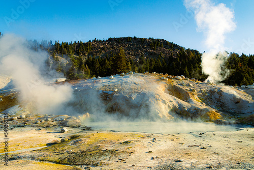 Large boiling mud pot at Bumpass Hell in Lassen Volcanic National Park in Northern California, USA. photo