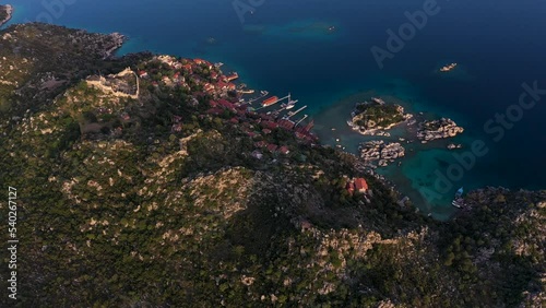 Aerial footage of beautiful turquoise sea and land forms of kekova ucagiz kalekoy from top drone view photo