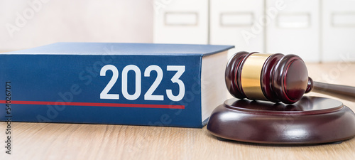 A law book with a gavel - 2023 photo
