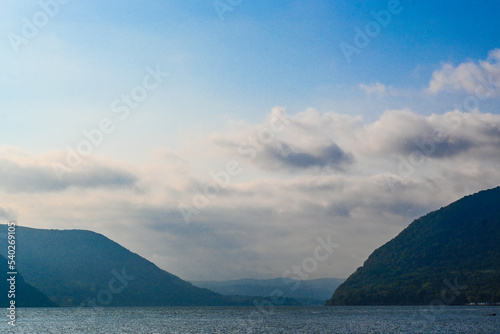 The Hudson River flows between Breakneck Ridge and Storm King Mountain in update New York state.