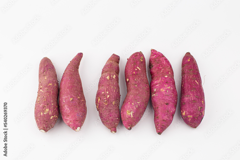 A sweet potato placed on a white background. A sweet potato placed on a white background.