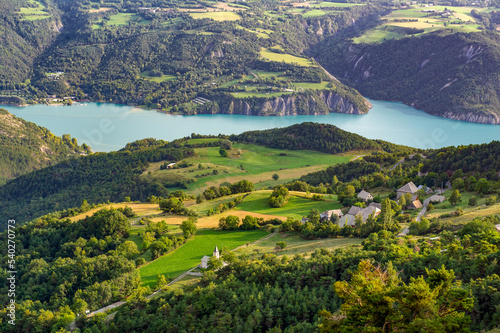 France. Hautes-Alpes (05). Serre-Ponçon Lake and the Pontis village from the Pontis Pass photo