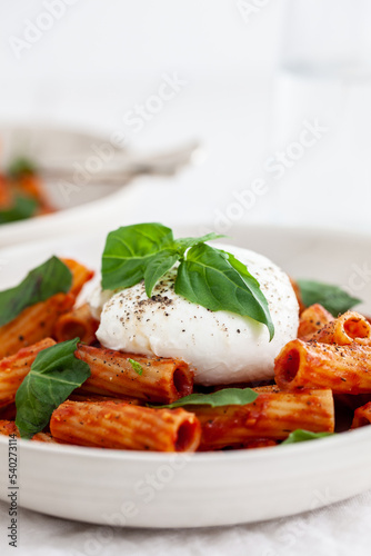 Pasta with tomato sauce and burrata