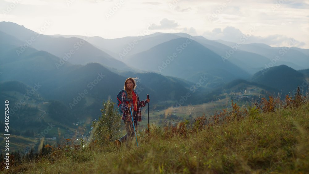 Backpacking woman explore mountains peak. Hiking tourist walk mountains nature.