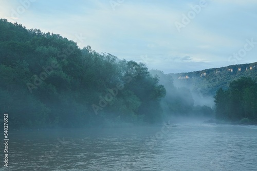 A swift mountain river. Water flows in nature. Mountainous terrain. © Fotoproff
