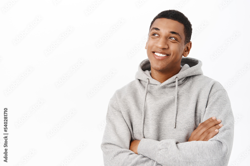 Happy people. Smiling african american man with hopeful smile, looking at camera confident, standing over white background Happy people. Smiling african american man with hopeful smile, looking at camera confident, standing over white background