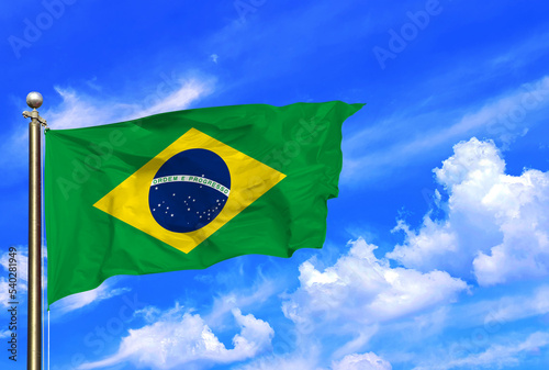 Brazil Ordem E Progresso Flag Waving In The Wind On A Beautiful Summer Blue Sky photo