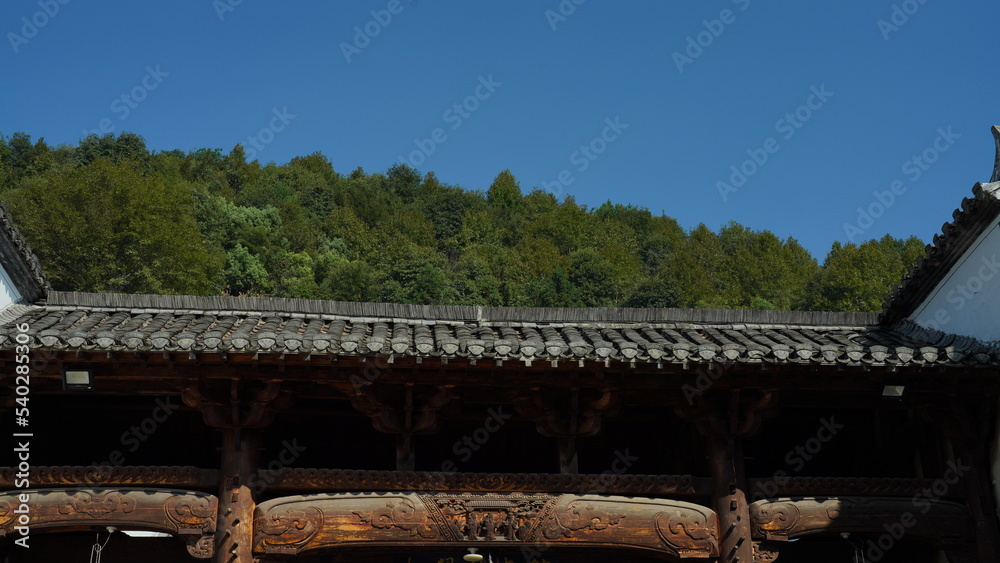 The old wooden Chinese house carved with the beautiful sculpture in the countryside village of the China