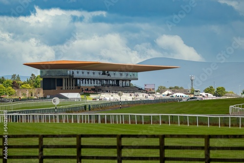 View of one of the most important Curragh racecourse under blue sky with clouds, Newbridge, Ireland photo
