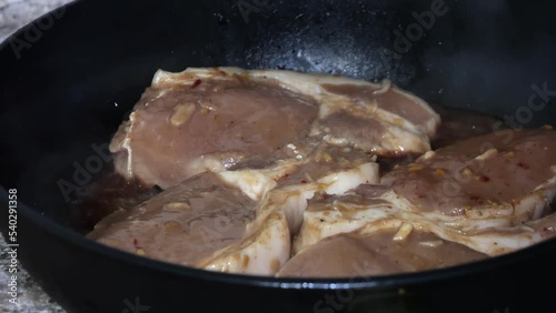 Wallpaper Mural frying meat close-up in a frying pan for christmas and holiday Torontodigital.ca