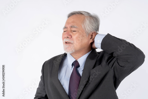 Asian senior man , old man with suit , He had pain in the nape of his neck caused by sleeping on a pillow that is not correct posture - Senior people