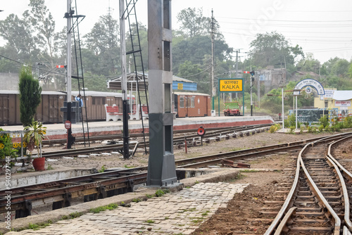View of Toy train Railway Tracks from the middle during daytime near Kalka railway station in India, Toy train track view, Indian Railway junction, Heavy industry
