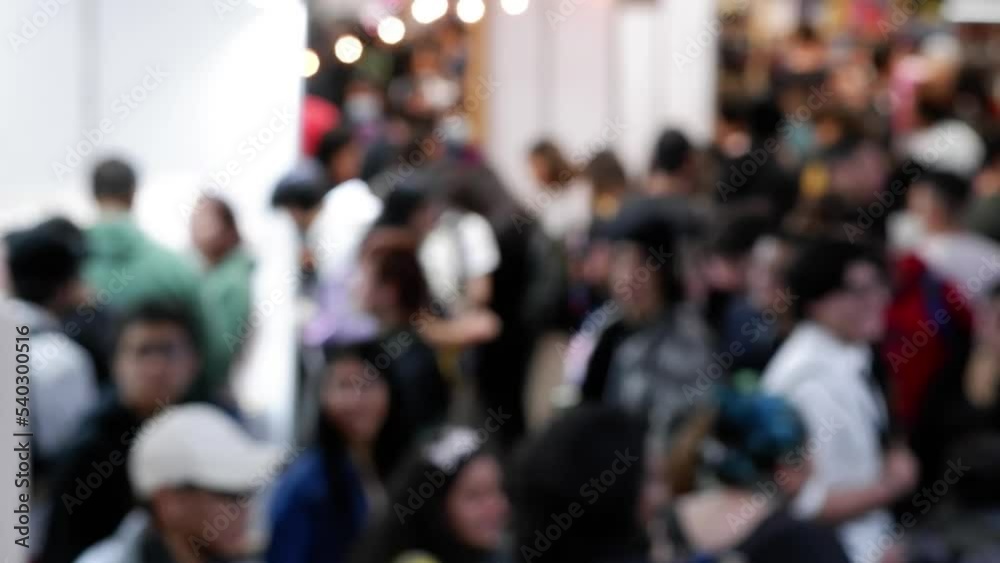 defocused video of many people walking in a fair from a top view defocused video of many people walking in a fair from a top view
