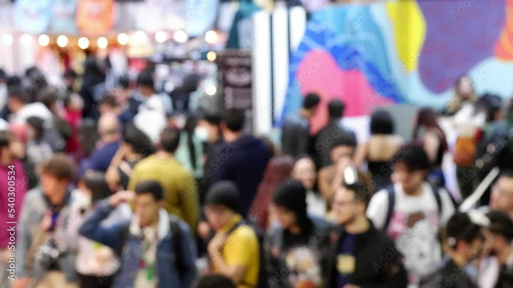 defocused video of people walking at a fair from a tilted top view defocused video of people walking at a fair from a tilted top view