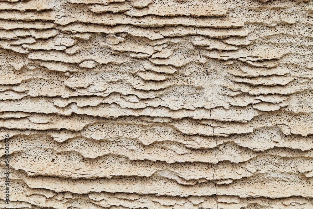 Background, texture of low-quality foam concrete after active exposure to water and wind Background, texture of low-quality foam concrete after active exposure to water and wind