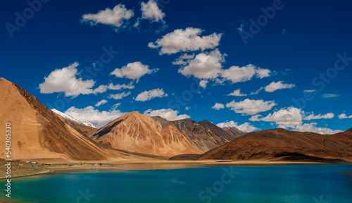 Pangong Lake world’s highest saltwater lake dyed in blue stand in stark contrast to the arid mountains surrounding