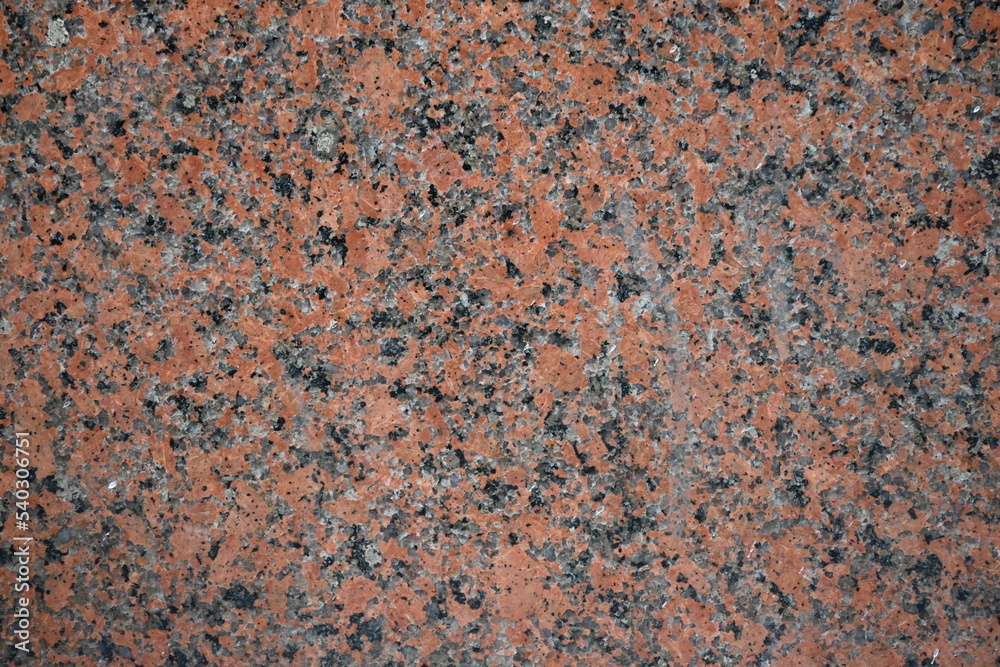 Fondo con detalle y textura de superficie de marmol en tonos rojizos, grises y negros Fondo con detalle y textura de superficie de marmol en tonos rojizos, grises y negros