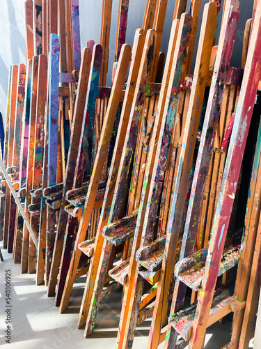 Easels at the art studio covered with paint