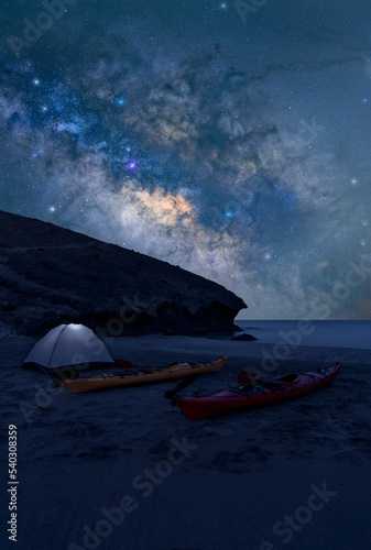 camping on the beach with the stars in the sky