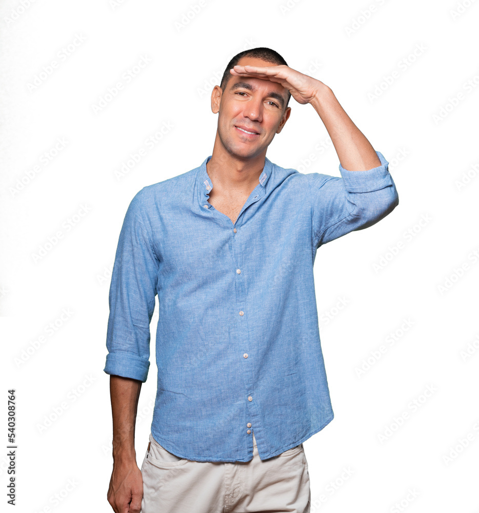 Fototapeta premium Happy young man with a gesture of looking away