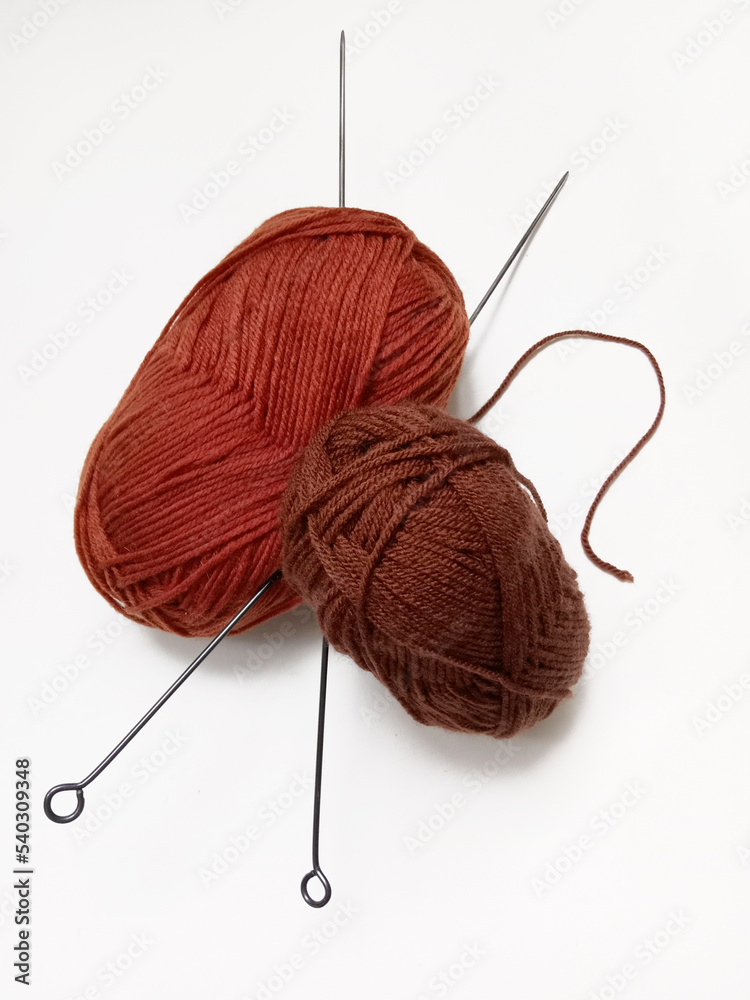 wool for knitting and knitting needles on a white background Stock ...