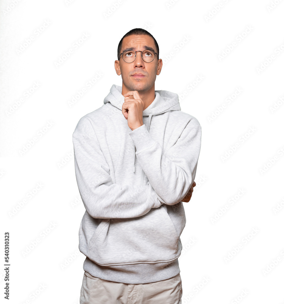 Serious young man looking against background Serious young man looking against background