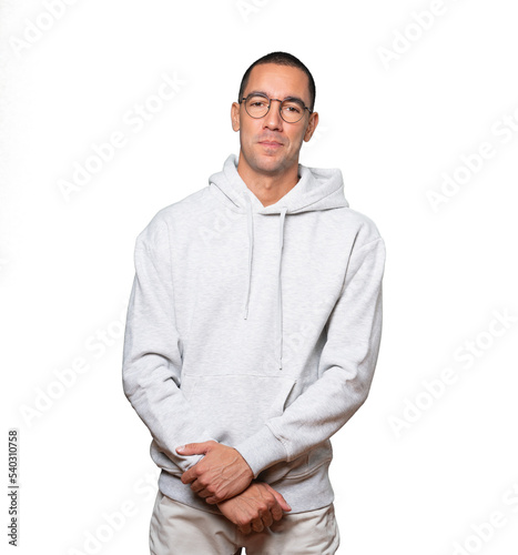 Happy young man posing against background