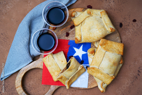 Empanadas de Pino or chilean beef empanadas with wine background