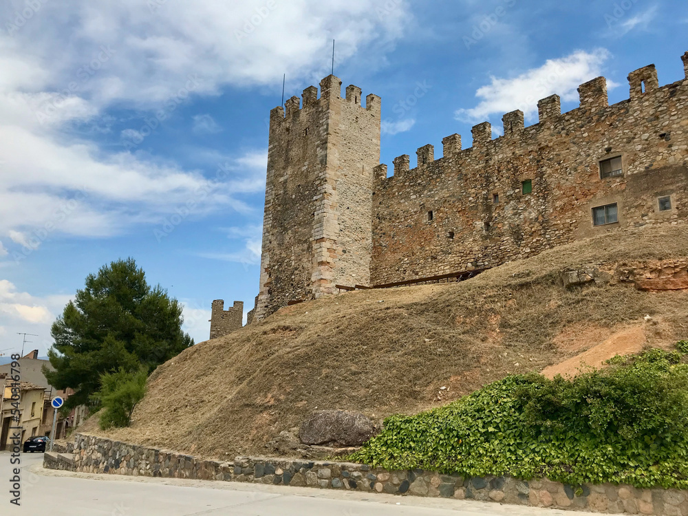 Montblanc, Spain, June 2019 - A castle on top of a stone building