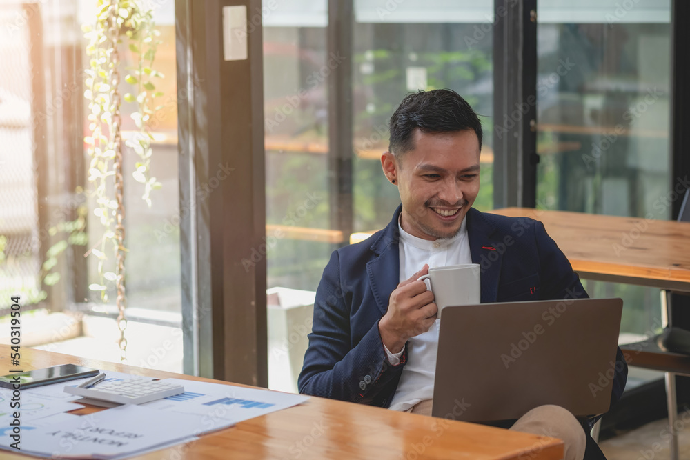 Team of business use calculators and graph analysis computer laptop tablets to plan marketing strategies and make profitable investments for the company.