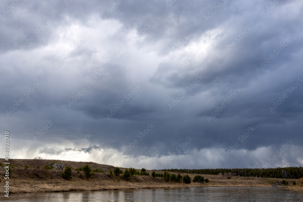 river bank and sky in the evening, cloudy sky and forest