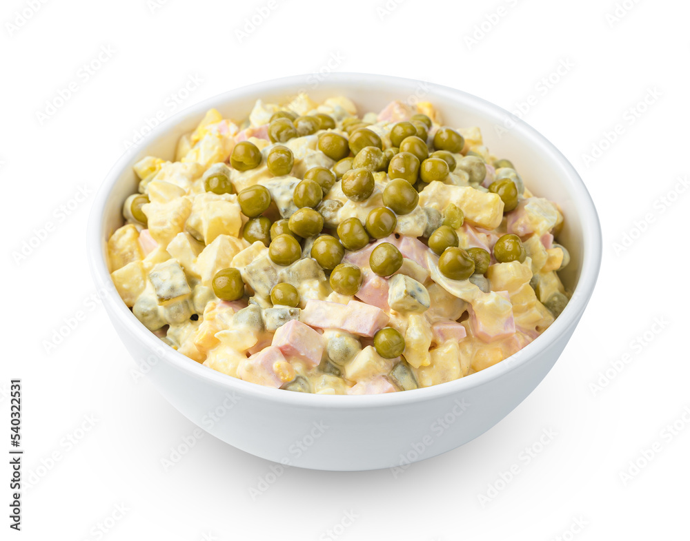 Olivier salad with vegetables, sausage and peas is isolated on a white background. Side view, close-up. Olivier salad with vegetables, sausage and peas is isolated on a white background. Side view, close-up.