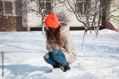 winter girl in warm hat in snow wintertime. winter fashion of girl in warm hat with wintertime snow photo
