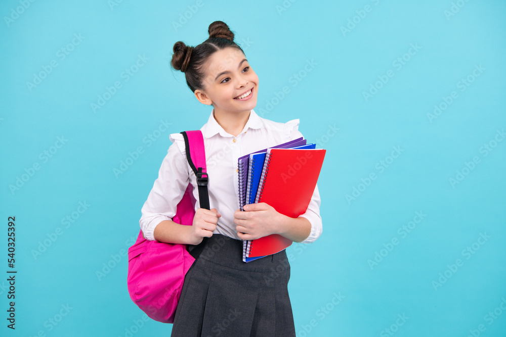School girl hold copybook and book on yellow blue isolated studio background. School and education concept. Teenager girl in school uniform. Happy teenager, positive and smiling emotions of teen girl. School girl hold copybook and book on yellow blue isolated studio background. School and education concept. Teenager girl in school uniform. Happy teenager, positive and smiling emotions of teen girl.