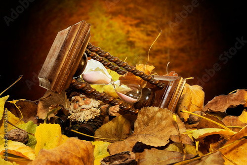 The time gnome with autumn hourglass