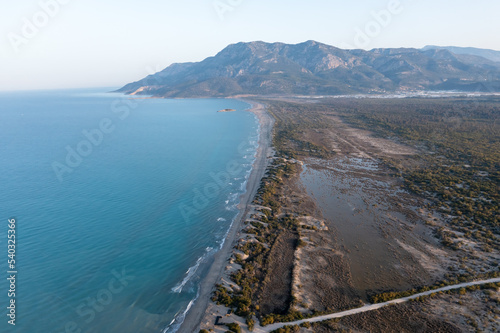 Aerial view of Patara beach with blue sea and sand, mountain and clear sky