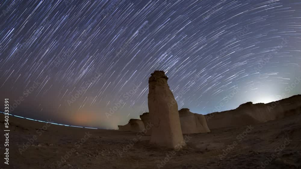 4K Time lapse of night sky star trail milky way fossil rock dune in Abu Dhabi. Stock Video