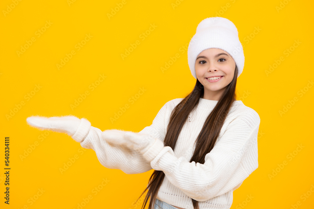 Wow, it's unbelievable. Shocked teenager child pointing aside at copy space. Teen girl pointing with two hands and fingers to the side. Wow, it's unbelievable. Shocked teenager child pointing aside at copy space. Teen girl pointing with two hands and fingers to the side.