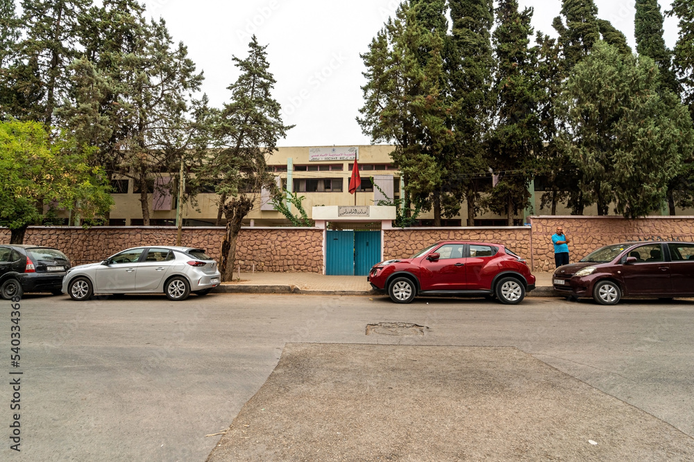 Cars parked on parallel on both sides of the road in Morocco