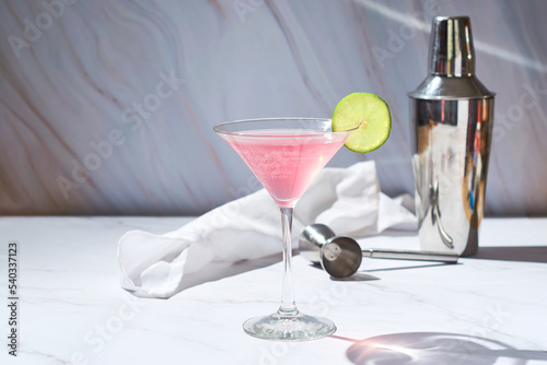 Fototapeta Naklejka Na Ścianę i Meble -  Refreshing Cold Pink Cosmopolitan Cocktail with Vodka and Cranberry