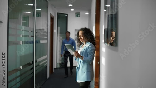 Wallpaper Mural Closeup positive partners working tablet hallway. Team discussing in corridor Torontodigital.ca
