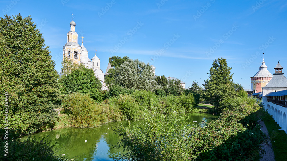 Russia. Vologda. Spaso-Prilutsky Dimitriev Monastery. Monastery Pond, behind it the Bell Tower and Spassky Cathedral