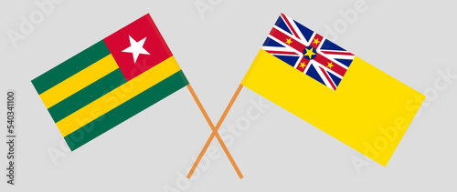 Crossed flags of Togo and Niue. Official colors. Correct proportion