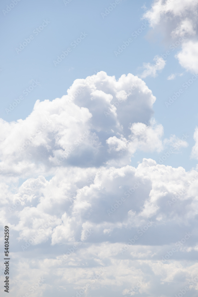 White large cumulus clouds in the blue sky. White large cumulus clouds in the blue sky.