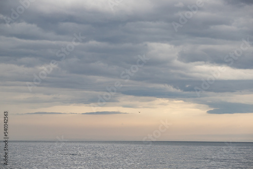 Blue sky background with white clouds.