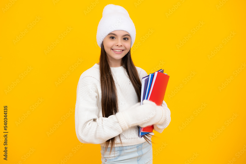 Schoolgirl child student with backpack and warn hat, isolated yellow background. Learning and knowledge education concept. Schoolgirl child student with backpack and warn hat, isolated yellow background. Learning and knowledge education concept.