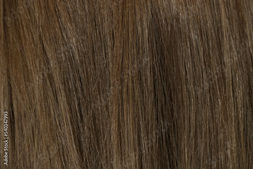 Natural brown hair background, close up